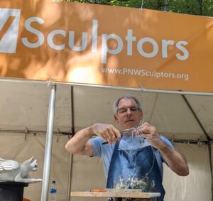 Sculptor Chas Martin doing a live demonstration.